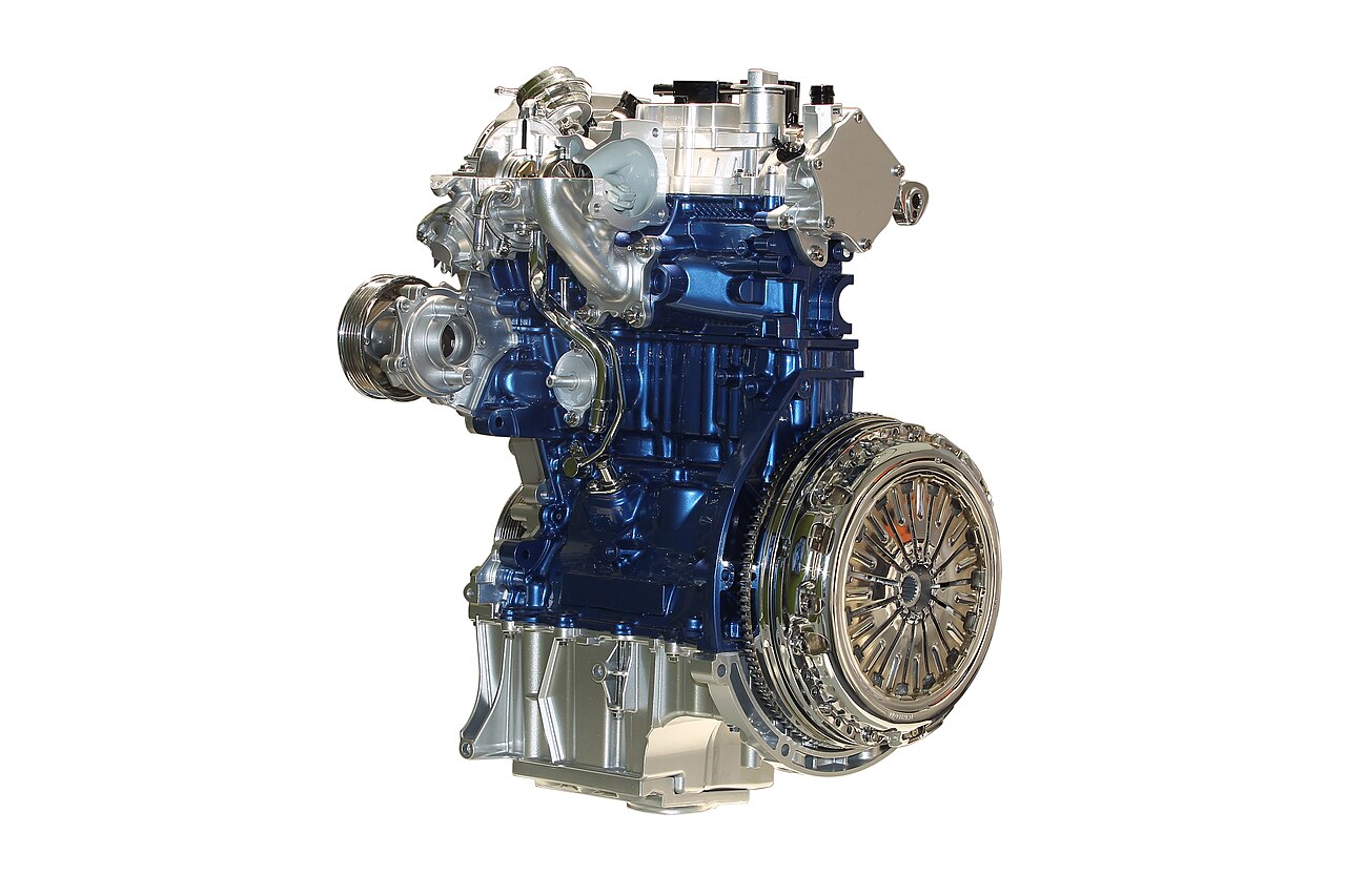The Ford 1.0-liter EcoBoost three-cylinder engine on a white background, seen from the front