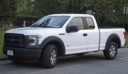 A white 2015 Ford F-150 XL pickup seen from the front left