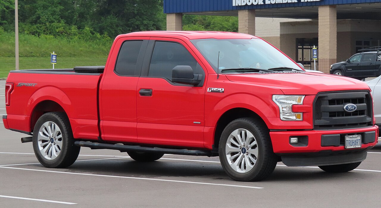 A red 2016 Ford F-150 XL SuperCab parked in a lot